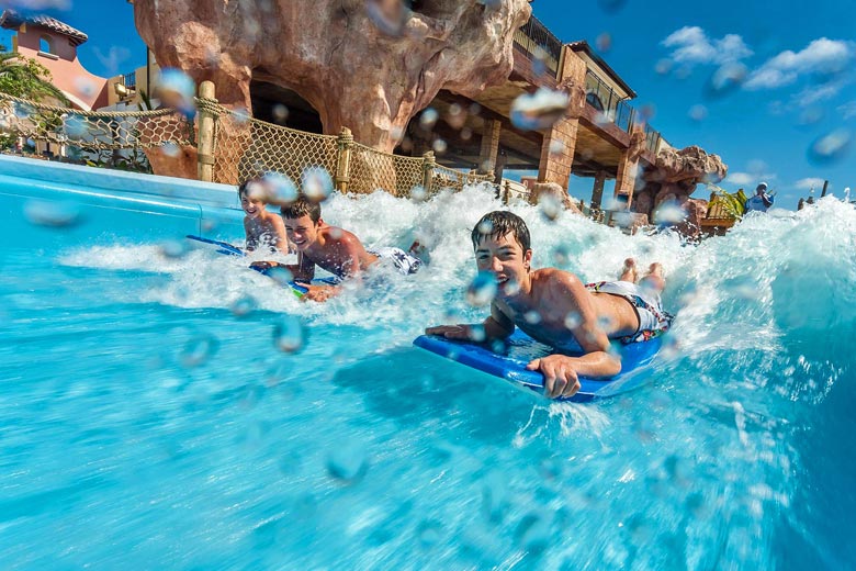 Kids on the surf simulator machine at Beaches Turks & Caicos