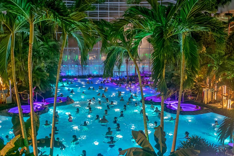 The palm-dotted ringed waters at Therme Bucuresti