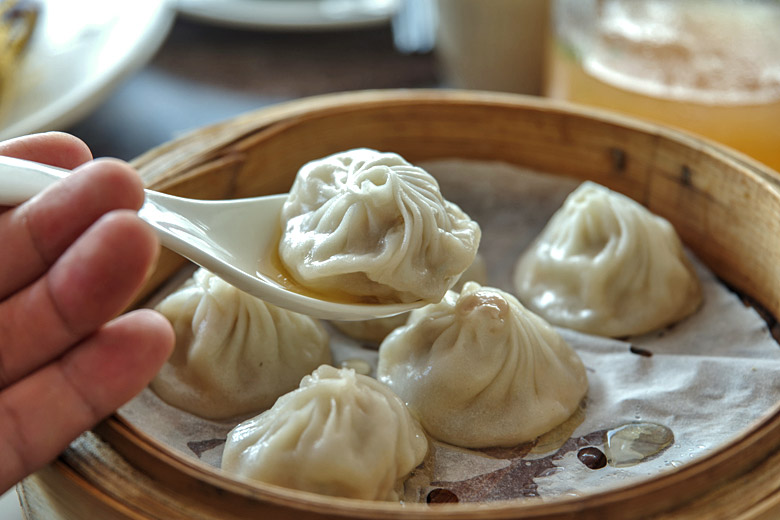 Enjoying delicious xiaolongbao dumplings in Nanxiang